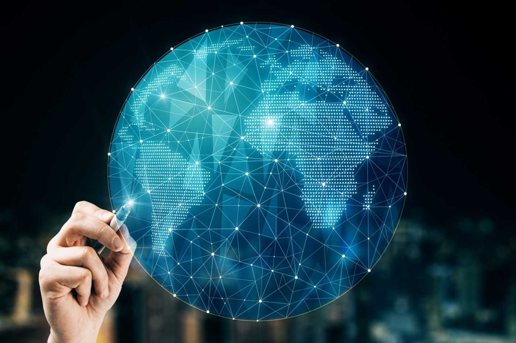 Hand pointing at creative glowing polygonal globe envato