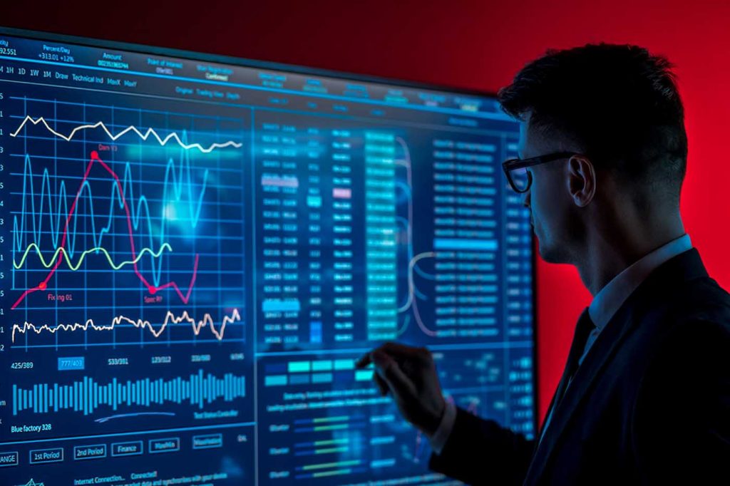 The man in suit looks on a blue screen with some envato